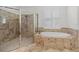 Bathroom with soaking tub and glass shower at 8476 Dunham Station Dr, Tampa, FL 33647