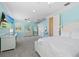 Bright bedroom with a white finish, large window, ceiling fan and a flat screen television at 8476 Dunham Station Dr, Tampa, FL 33647