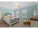 Bright bedroom with white furniture, ceiling fan, and plantation shutters at 8476 Dunham Station Dr, Tampa, FL 33647