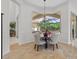 Bright dining area with a view of the pool and lanai at 8476 Dunham Station Dr, Tampa, FL 33647