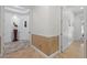 Neutral hallway with marble floors and accent decor at 8476 Dunham Station Dr, Tampa, FL 33647