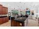 Gourmet kitchen with granite countertops, stainless steel appliances, and custom cabinetry at 8476 Dunham Station Dr, Tampa, FL 33647