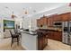 Gourmet kitchen with granite countertops, stainless steel appliances, and custom cabinetry at 8476 Dunham Station Dr, Tampa, FL 33647