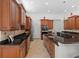 Gourmet kitchen with granite countertops, stainless steel appliances, and custom cabinetry at 8476 Dunham Station Dr, Tampa, FL 33647