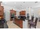 Gourmet kitchen with granite countertops, stainless steel appliances, and custom cabinetry at 8476 Dunham Station Dr, Tampa, FL 33647