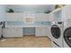Laundry room featuring ample counter space and natural light at 8476 Dunham Station Dr, Tampa, FL 33647