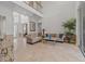 Elegant living room with soaring ceilings and tile flooring at 8476 Dunham Station Dr, Tampa, FL 33647