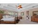 Main bedroom with tray ceiling and neutral color palette at 8476 Dunham Station Dr, Tampa, FL 33647