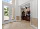 Office space with tile flooring, dark wood furniture, and natural light at 8476 Dunham Station Dr, Tampa, FL 33647