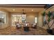 Covered patio seating area with a fire pit and views of the home at 8476 Dunham Station Dr, Tampa, FL 33647