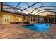 This is a beautiful custom pool with a covered lanai perfect for outdoor entertaining and sunset views at 8476 Dunham Station Dr, Tampa, FL 33647