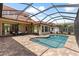 Screened-in pool and patio area is perfect for outdoor entertaining at 8476 Dunham Station Dr, Tampa, FL 33647