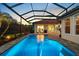Enjoy this beautiful custom pool with a covered lanai perfect for outdoor entertaining and sunset views at 8476 Dunham Station Dr, Tampa, FL 33647