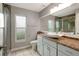 Updated bathroom featuring granite counters, vessel sink, and a tiled shower at 8635 Chadwick Dr, Tampa, FL 33635