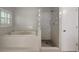 Bathroom featuring tub and shower combo, and tile flooring at 8635 Chadwick Dr, Tampa, FL 33635