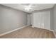 This bedroom has a ceiling fan and closet space at 8635 Chadwick Dr, Tampa, FL 33635