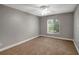 This bedroom has neutral walls and a ceiling fan at 8635 Chadwick Dr, Tampa, FL 33635