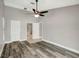 Bedroom with carpet, ceiling fan, neutral paint and trim, closet, and attached bathroom at 8635 Chadwick Dr, Tampa, FL 33635