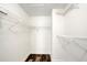 Walk-in closet with wire shelving and wood-look floors at 8635 Chadwick Dr, Tampa, FL 33635