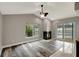 Living room with vaulted ceilings, black fireplace, and sliding glass doors leading to the pool at 8635 Chadwick Dr, Tampa, FL 33635