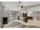 Open floor plan with fireplace, kitchen access, and sliding doors to the pool at 8635 Chadwick Dr, Tampa, FL 33635