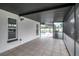 Covered patio with tile flooring and a view of the screened-in pool area at 8635 Chadwick Dr, Tampa, FL 33635
