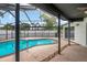 This beautiful backyard has a screened-in pool at 8635 Chadwick Dr, Tampa, FL 33635