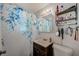 Bathroom featuring a sink, toilet, and a blue and white floral shower curtain at 10436 117Th Dr, Largo, FL 33773