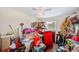 Cluttered bedroom with a window, an overhead light, and carpeted floors at 10436 117Th Dr, Largo, FL 33773