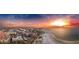 Gorgeous aerial view of a coastal community with a beach and stunning sunset at 100 Bayside Dr # 202, Clearwater Beach, FL 33767