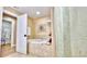 Beautiful bathroom featuring a soaking tub, elegant tile work, and spa-like atmosphere at 100 Bayside Dr # 202, Clearwater Beach, FL 33767