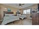 Bedroom with two twin beds, ceiling fan, and view from the window at 100 Bayside Dr # 202, Clearwater Beach, FL 33767