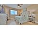 Charming bedroom with a comfy queen-size bed, large window with skyline view at 100 Bayside Dr # 202, Clearwater Beach, FL 33767