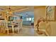 Cozy dining room leads into the living room with views to the outside at 100 Bayside Dr # 202, Clearwater Beach, FL 33767