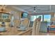 Dining room flows into the living room with outside views and comfortable furniture at 100 Bayside Dr # 202, Clearwater Beach, FL 33767