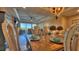 Open-concept dining room with seating for six and views into the living room at 100 Bayside Dr # 202, Clearwater Beach, FL 33767