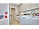 Convenient laundry room with modern washer and dryer units at 100 Bayside Dr # 202, Clearwater Beach, FL 33767