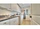 Laundry room features upper cabinets and a washer/dryer at 100 Bayside Dr # 202, Clearwater Beach, FL 33767