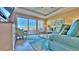 Comfortable living room area that opens to a balcony with views at 100 Bayside Dr # 202, Clearwater Beach, FL 33767