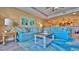 Inviting living room featuring comfortable blue sofas, stylish decor, and an open layout at 100 Bayside Dr # 202, Clearwater Beach, FL 33767