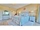 Comfortable main bedroom with a decorative king bed and a light and airy feel at 100 Bayside Dr # 202, Clearwater Beach, FL 33767