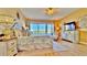 Spacious main bedroom includes a tv, dresser, and sliding glass doors with a view at 100 Bayside Dr # 202, Clearwater Beach, FL 33767