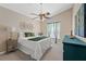 Tranquil bedroom featuring fan, plush carpet, and natural light showcasing simple comfort at 10032 Basin St, New Port Richey, FL 34655