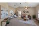 Living room featuring a ceiling fan, neutral walls, and comfortable seating arrangement at 10032 Basin St, New Port Richey, FL 34655