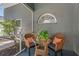 This patio features two chairs with a table, great for outdoor relaxation and enjoyment at 10032 Basin St, New Port Richey, FL 34655