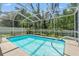 This large screened pool offers a perfect spot for recreation and relaxation at 10032 Basin St, New Port Richey, FL 34655
