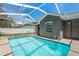 This screened pool is adjacent to the home and offers a great area for outdoor fun and lounging at 10032 Basin St, New Port Richey, FL 34655