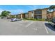 Cozy condo complex featuring dedicated parking, lush landscaping, and a community fire hydrant at 10195 Sailwinds N Blvd # 208, Largo, FL 33773