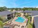 Community pool with lounge chairs for relaxing and enjoying the outdoors at 10195 Sailwinds N Blvd # 208, Largo, FL 33773