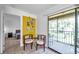 Cozy sitting area beside a screened lanai offering lots of natural light and an adjacent bedroom at 10195 Sailwinds N Blvd # 208, Largo, FL 33773